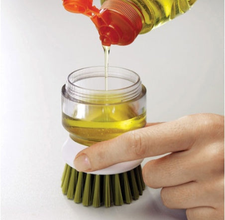 Cepillo para lavar platos y ollas con jabón líquido para vajilla